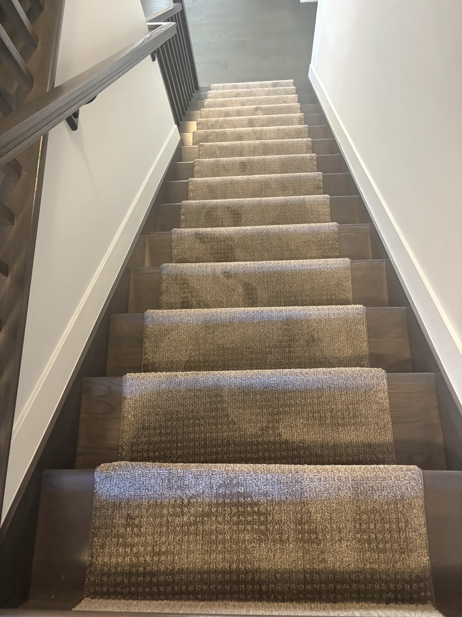 Carpet stair runner seen from the top of the staircase